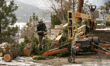 Towable manlift and a dead tree